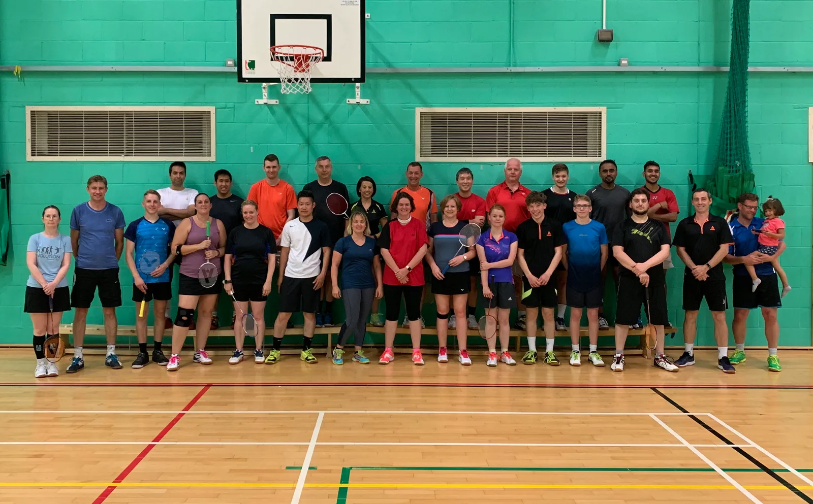 Top Flight club members together on an indoor badminton court
